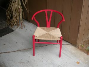 Curved and low back caned chair